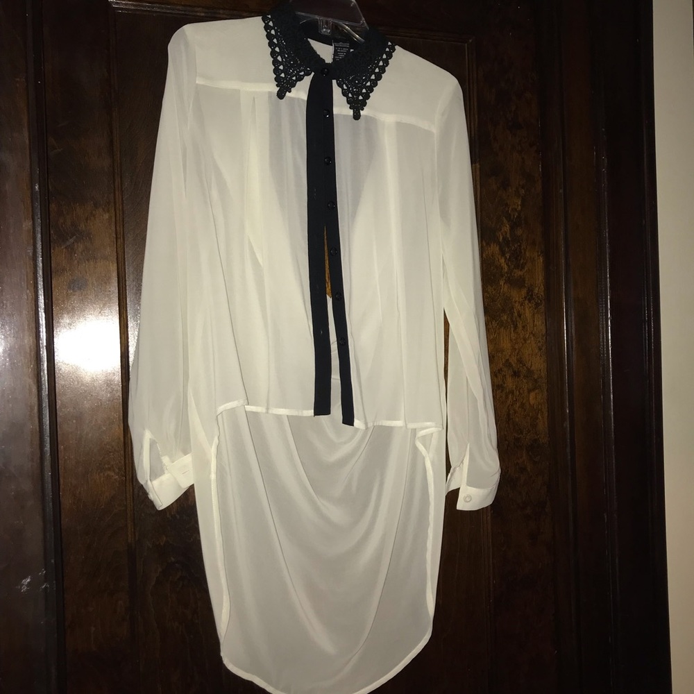 Sheer shirt with black lace collar.